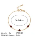 Elegante bracciale a catena vintage dorato con perle in resina rosso scuro e parametri - Bracciale con Tre Perle d'Ambra / Ambra