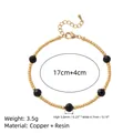 Bracciale vintage di perline dorate con dettagli in resina nera e un'estensione. - Bracciale di Perline Nero / Nero