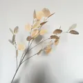 Close-up of realistic artificial beige eucalyptus leaf branch for wedding decor - Champagne (30 Leaves)