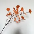 Detailed view of artificial orange eucalyptus branch with realistic silk-screened leaves - Light Orange (30 Leaves)