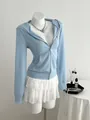 Slim-fit light blue zip-up hoodie presented on a mannequin with elegant accessories - S / Tops / Light Blue
