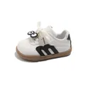 Vista dettagliata delle sneakers in pelle bianca per bambini con decori a forma di occhi - Taglia 18 Lunghezza Interna/13cm / Nero
