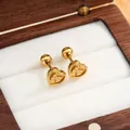 Orecchini a cuore in acciaio al titanio dorato con chiusura a vite e grazioso fiocco - Fiocco Cuore Oro Coppia