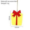 Yellow gift box shape felt Christmas tree ornament with red bow and white polka dots - Gift