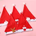 Collection of festive red plush Christmas hats featuring cute Santa and reindeer designs. - Kids