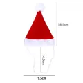 Mini red and white pet Santa hat with elastic strap, dimensions shown 18.5x9.5cm - L
