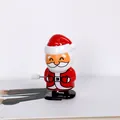 Detailaufnahme vom Weihnachtsmann-Aufziehspielzeug mit mechanischem Uhrwerk-System. - Weihnachtsmann