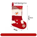 Festive red Christmas stocking decoration with snowman face and gold foil patterns - Red Gold-Stamped Christmas Stocking - Snowman