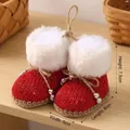 Small red knitted Christmas boot ornaments with white faux fur trim and silver beads - Knitted Christmas Boots / Red