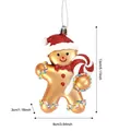 Gouden peperkoekman kerstornament met een rode glittermuts en zuurstok, hoogte 13cm - Gingerbread Jongen Hanger