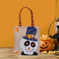 Halloween linen burlap candy gift bag featuring a cute cartoon skull with striped handles - Skull Pattern