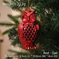 Red shiny electroplated owl Christmas ornament hanging on a festive tree branch decoration - Owl / Red Owl