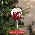 Red and white swirl lollipop Christmas tree ornament hanging with colorful sprinkles - Red Lollipop