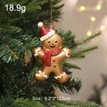 Gingerbread man Christmas tree ornament, gold finish with red glitter hat and scarf - Pointed Hat Scarf Style