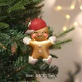 Golden gingerbread man Christmas ornament with red cap for tree decoration - Peaked Cap Style