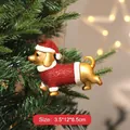 Hand-painted gold dachshund dog Christmas ornament wearing a red glitter Santa suit - Dog / Gold