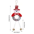Plush Christmas teddy bear hanging ornament with bells showing dimensions 21cm by 9cm - Bear