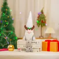 Festive Christmas Rudolph gnome plush doll with a white sequined antler hat sitting on books - Rhombic Sequin Long Legged Style / Rainbow