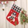 Small red Christmas stocking featuring a cute snowman design and golden bells decoration - Black and White Plaid Stocking with Bell (Snowman)