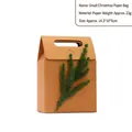 Small brown kraft paper Christmas gift bag featuring handle and decorative green pine sprig - Tree Branch / S