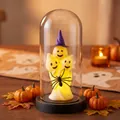 Glowing Halloween ghost trio in a glass dome with a purple witch hat ornament. - Plastic Dome / Purple Hat