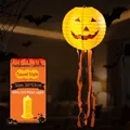 Orange Halloween pumpkin paper lantern with long tassels and yellow LED light pole accessory - Hanging 8" Halloween Ribbon Lanterns with LED Lights