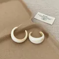 Elegant cream marbled resin C-shaped hoop earrings with a vintage minimalist French style - Ivory White C Ring