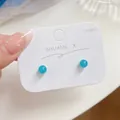 Elegant minimalist marine blue round bead stud earrings featuring 925 silver needles. - Round Stone Stud Earrings / Aquamarine