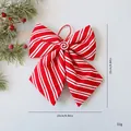 Grote rood-wit gestreepte kerststrik decoratie met een lolly-ornament in het midden - 25cm / Rood-Wit Gestreepte