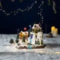 Detailed view of a Christmas musical snow house with cable cars and glowing lights. - Ski Cable Car Music Box