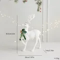 Elegante weiße beflockte Weihnachtsrentier-Figur mit grüner Schleife und Maßen - Fußhebendes Rentier