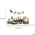 Musical Christmas snow village resin ornament with flying Santa sleigh, 34cm wide - Flying Deer Music Box
