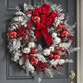 Close-up of a 50cm flocked Christmas wreath with a large red velvet bow on a door - 45CM Red Flocked Wreath / 1 Piece
