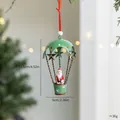 Metalen kerstornament, kerstman in groene heteluchtballon met maten - Kerstman Parachute (Groen IJzer) / Enkel Stuk
