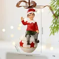 Vintage resin Christmas boy elf ornament sitting on a white star ball with brown ribbon - Elf on Christmas Ball