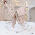 Glittering fabric butterfly ornament for festive Christmas tree decoration. - 22*20cm / Champagne