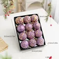 Set of 12 purple and gold Christmas ornament balls with glitter patterns in a black box. - Purple
