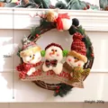 Festive 39cm Christmas vine wreath featuring plush snowmen and 'Let It Snow' banner - Snowman Family with Red Scarf