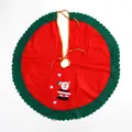 Festive red and green Christmas tree skirt featuring a Santa Claus appliqué and gold ties - Felt / Red and Green