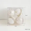 Lot de 4 boules de Noël blanches peintes avec des accents de paillettes dorées chic - Lot de 4 / 8cm / Blanc Lait
