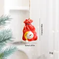 Handcrafted red resin Christmas bag ornament featuring a snowman face and Let It Snow text - Snowman Gift Bag (SZGJ17)