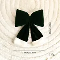 Large dark green velvet Christmas bow decoration with white faux fur trim and dimensions - Bow / Green Velvet 28cm