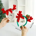 Cerchietti con corna di renna natalizie con fiocchi rossi, misure e peso indicati. - Pompon + Pacco Regalo (Bambino)