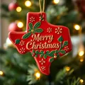 Close-up of red Texas-shaped Christmas tree ornament with golden Merry Christmas text - Texas