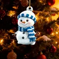 Cute cartoon Christmas snowman ornament hanging on a decorated tree - Style 6