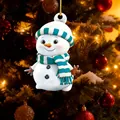 Detailed view of a cute cartoon snowman ornament hanging on a festive Christmas tree - Style 7