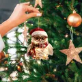 Hand holding a cute owl Christmas tree ornament with festive lights and Santa hat - Style 01