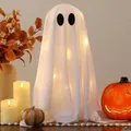 Detailed view of white fabric Halloween ghost decoration with warm yellow LED lights - Single Piece / 1 Piece