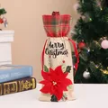 Festive burlap wine bottle bag with red plaid cuff and large red poinsettia flower - Red Floral