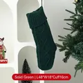 Traditional dark green cable-knit Christmas stocking hanging for holiday gift display - Cable Knit Christmas Stocking / Solid Green